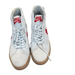 Selling Nike sneakers size 12. Red Nike tick.